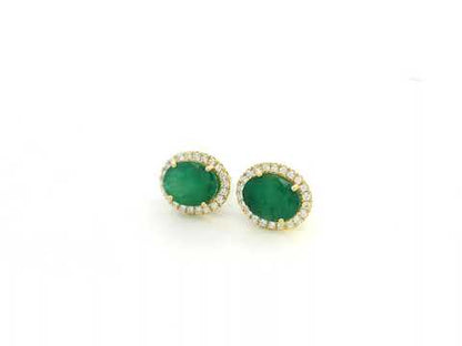 18K yellow gold emerald and diamond halo stud earrings with oval emeralds and brilliant diamond accents by Emirates Diamonds.