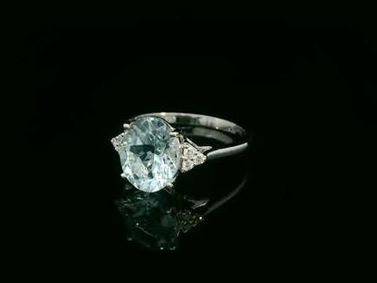 18K white gold oval aquamarine ring with diamond side clusters – 2.45ct aquamarine, 0.08ct diamonds by Emirates Diamonds