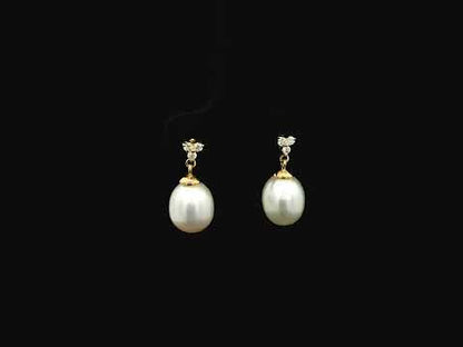 White pearl drop earrings with diamond accents in 18K yellow gold