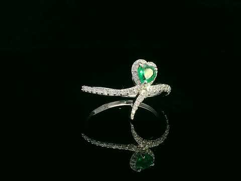 Heart-shaped emerald bypass ring in 18K white gold with diamond halo

