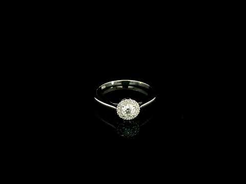 Round diamond halo engagement ring in 18K white gold