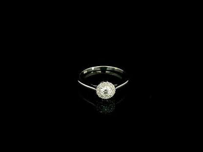Round diamond halo engagement ring in 18K white gold
