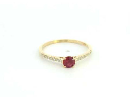 Ruby and diamond solitaire ring in 18K yellow gold featuring a 0.36 carat natural ruby and 0.11 carat diamonds
