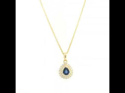Pear shaped blue sapphire and double diamond halo pendant in 18K yellow gold