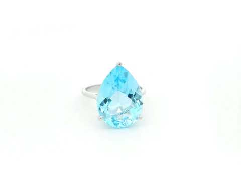 Large pear cut blue topaz solitaire ring in 18K white gold statement design