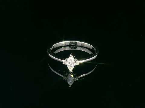 18K gold marquise diamond ring featuring a 0.19-carat marquise-cut center stone with 0.04-carat round diamond accents. Perfect as an engagement ring, stacking ring, or elegant everyday jewelry