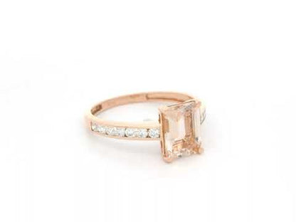 Emerald-cut morganite and diamond ring in 18K rose gold with 1.41 carat morganite and diamond band by Emirates Diamonds.