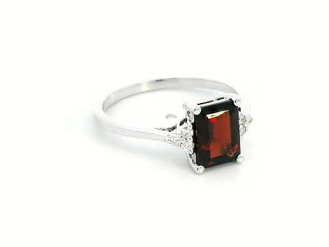 Emerald-cut 1.79-carat Garnet ring with 0.08-carat diamond accents in 18K gold – a stunning January birthstone jewelry piece