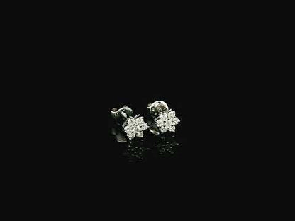 Diamond flower cluster stud earrings in 18K white gold by Emirates Diamonds