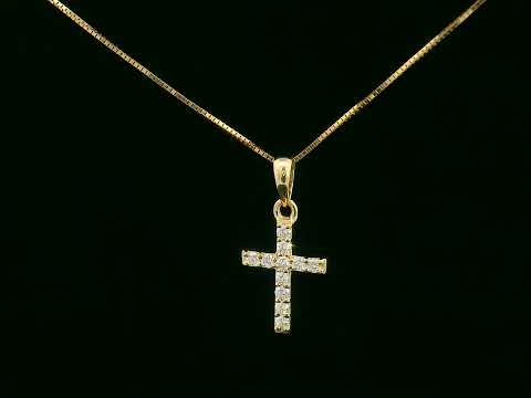 Petite diamond cross pendant in 18K gold with 11 round-cut diamonds totaling 0.13 carat