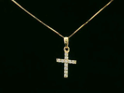 Petite diamond cross pendant in 18K gold with 11 round-cut diamonds totaling 0.13 carat