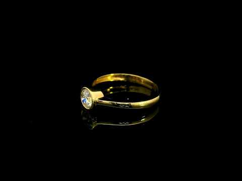 Round brilliant bezel set diamond engagement ring in 18K yellow gold with a slender solitaire band.