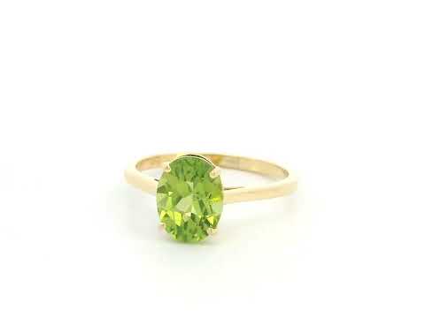 18K yellow gold oval peridot solitaire ring featuring a 2.17 carat natural peridot gemstone