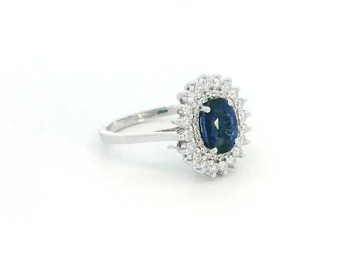 Elegant 2.00 carat sapphire halo ring with 0.53 carats of diamonds, set in 18K white gold. Classic halo design enhances brilliance—perfect as a September birthstone ring.