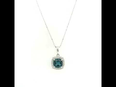 Cushion-cut London Blue Topaz diamond halo pendant in 18K white gold.