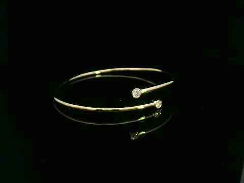 Diamond open cuff bangle bracelet in 18K yellow gold with bezel set diamonds by Emirates Diamonds