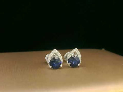 18K white gold teardrop halo stud earrings with round blue sapphires and diamonds