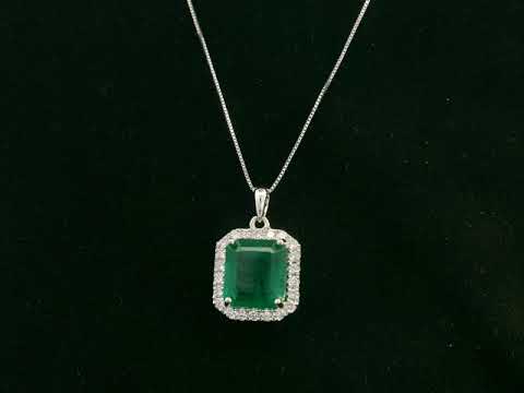 Emerald-cut emerald and diamond halo pendant in 18K white gold – Emirates Diamonds