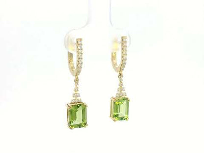 Emerald-cut Peridot and diamond drop earrings in 18K white gold, featuring vibrant green gemstones and brilliant diamond accents.