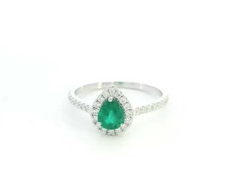 Pear shape emerald and diamond halo ring in 18K white gold by Emirates Diamonds