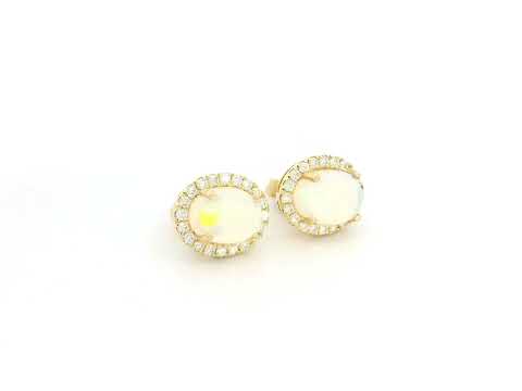 Oval opal and diamond halo stud earrings in 18K yellow gold by Emirates Diamonds.