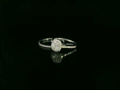 Cushion cut diamond bridal ring set in 18K white gold with diamond wedding band by Emirates Diamonds.