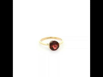 Natural 1.90 carat round garnet solitaire ring in solid 18K yellow gold featuring a contemporary semi-bezel style setting.