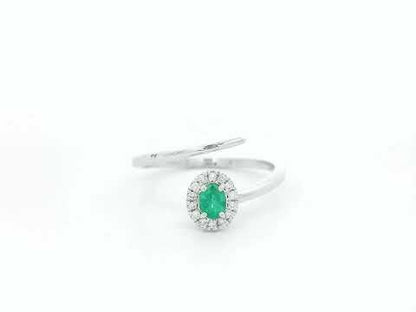 Emerald diamond halo wrap ring in 18K white gold with oval emerald and diamond halo