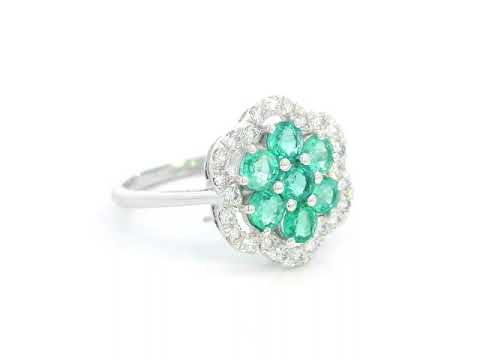 Floral emerald cluster and diamond halo ring in 18K gold

