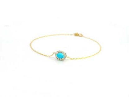 18K gold bracelet with a 0.54-carat turquoise gemstone surrounded by a 0.16-carat diamond halo on a delicate gold chain