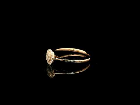 Oval diamond cluster ring in 18K rose gold with round diamonds and a slim polished band.