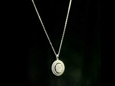 Oval diamond cluster pendant in 18K white gold with a central round diamond cluster and two diamond-set oval surrounds.