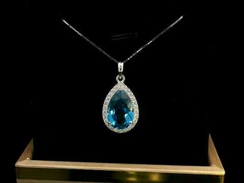 18K white gold pendant with a 5.87ct pear-shaped London Blue Topaz, surrounded by a 0.33ct diamond halo. Chain not included.