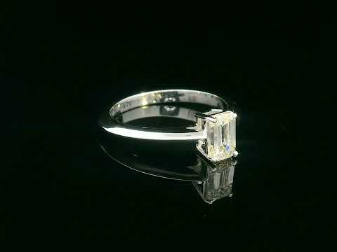 0.91 carat emerald cut diamond solitaire ring with knife-edge 18K gold band, minimalist and elegant design.