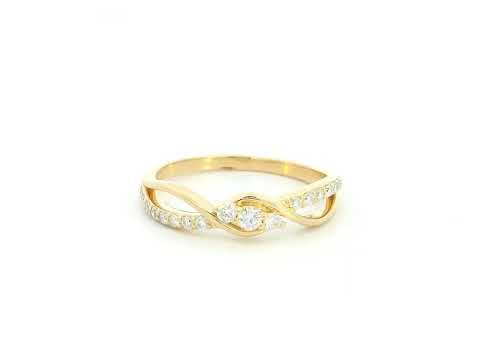 Natural diamond infinity ring in solid 18K yellow gold featuring 0.28 carat round brilliant diamonds in an elegant flowing infinity design.