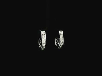 Diamond hoop earrings in 18K white gold featuring 0.98 carats of diamonds by Emirates Diamonds.