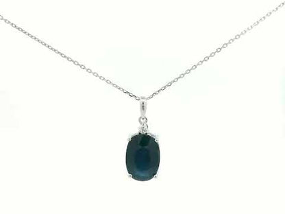 Blue sapphire pendant with diamond connector in prong setting
