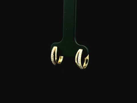 Small diamond huggie hoop earrings in 18K yellow gold by Emirates Diamonds