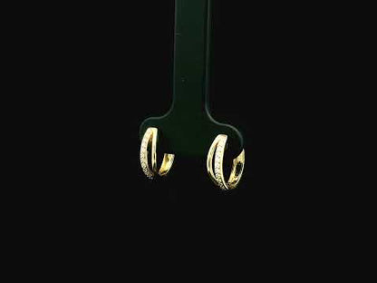 Small diamond huggie hoop earrings in 18K yellow gold by Emirates Diamonds