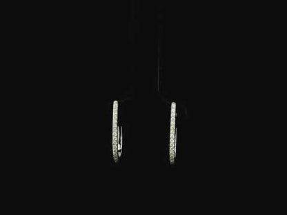 Pavé diamond hoop earrings in 18K white gold with 0.21 carat natural diamonds by Emirates Diamonds.