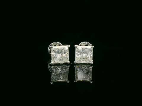 Princess cut diamond solitaire stud earrings in 18K white gold featuring 2.02 carats total GIA certified VS2 F color diamonds by Emirates Diamonds