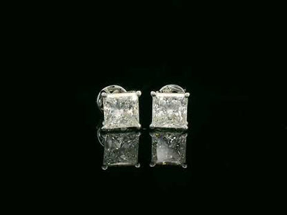 Princess cut diamond solitaire stud earrings in 18K white gold featuring 2.02 carats total GIA certified VS2 F color diamonds by Emirates Diamonds