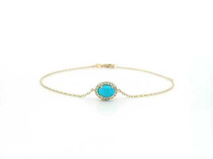 Turquoise diamond halo bracelet in 18K yellow gold with delicate chain by Emirates Diamonds
