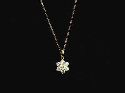 Diamond flower cluster pendant in 18K yellow gold featuring 0.55 carats of diamonds by Emirates Diamonds.