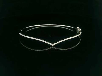 18K gold V-shape bangle bracelet with 0.34 carats of round-cut diamonds, featuring a modern tapered silhouette and minimalist design.