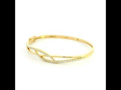 18K yellow gold diamond crossover bangle with 0.80 carat round brilliant natural diamonds and intertwined polished gold design