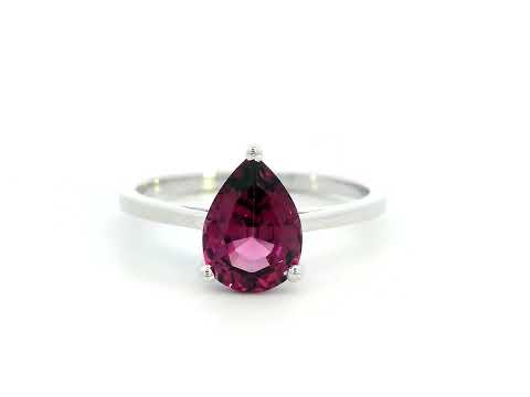 18K white gold pear-shaped Rhodolite ring with a smooth polished band, featuring a minimalist and timeless design.