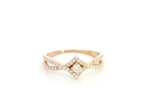 Diamond halo twist ring in 18K rose gold featuring 0.39 carat natural diamonds