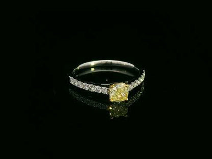 White gold ring with cushion yellow diamond and side diamonds