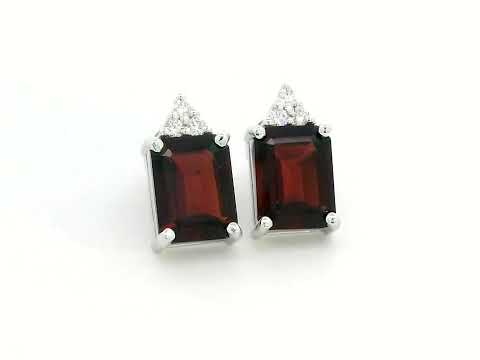 18K white gold garnet and diamond stud earrings featuring emerald-cut garnets (4.11 CT total) with a delicate diamond cluster (0.09 CT total), set in a classic and elegant stud design.